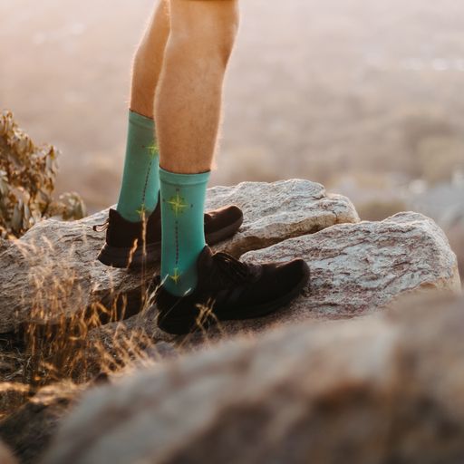 Navigator Socks on the rocks during a hike